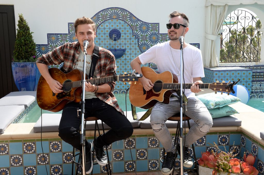 "SANTA MONICA, CA - MAY 14: Musicians Kendall Schmidt (L) and Dustin Belt of musical group 'Heffron Drive' perform at Cost Plus World Market's Santa Monica Beach House Party #Celebrate Outdoors on May 14, 2016 in Santa Monica, California. (Photo by Michael Kovac/Getty Images for Cost Plus World Market)"